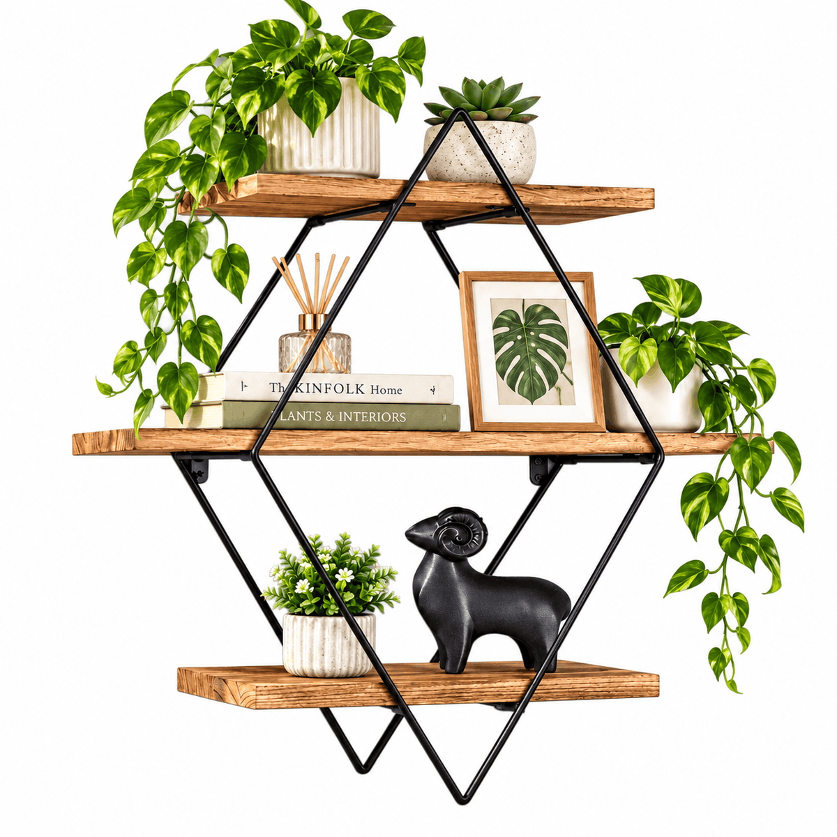 Three tier diamond wall shelf with brown wood boards and a black metal frame holding plants, a framed leaf print and decor