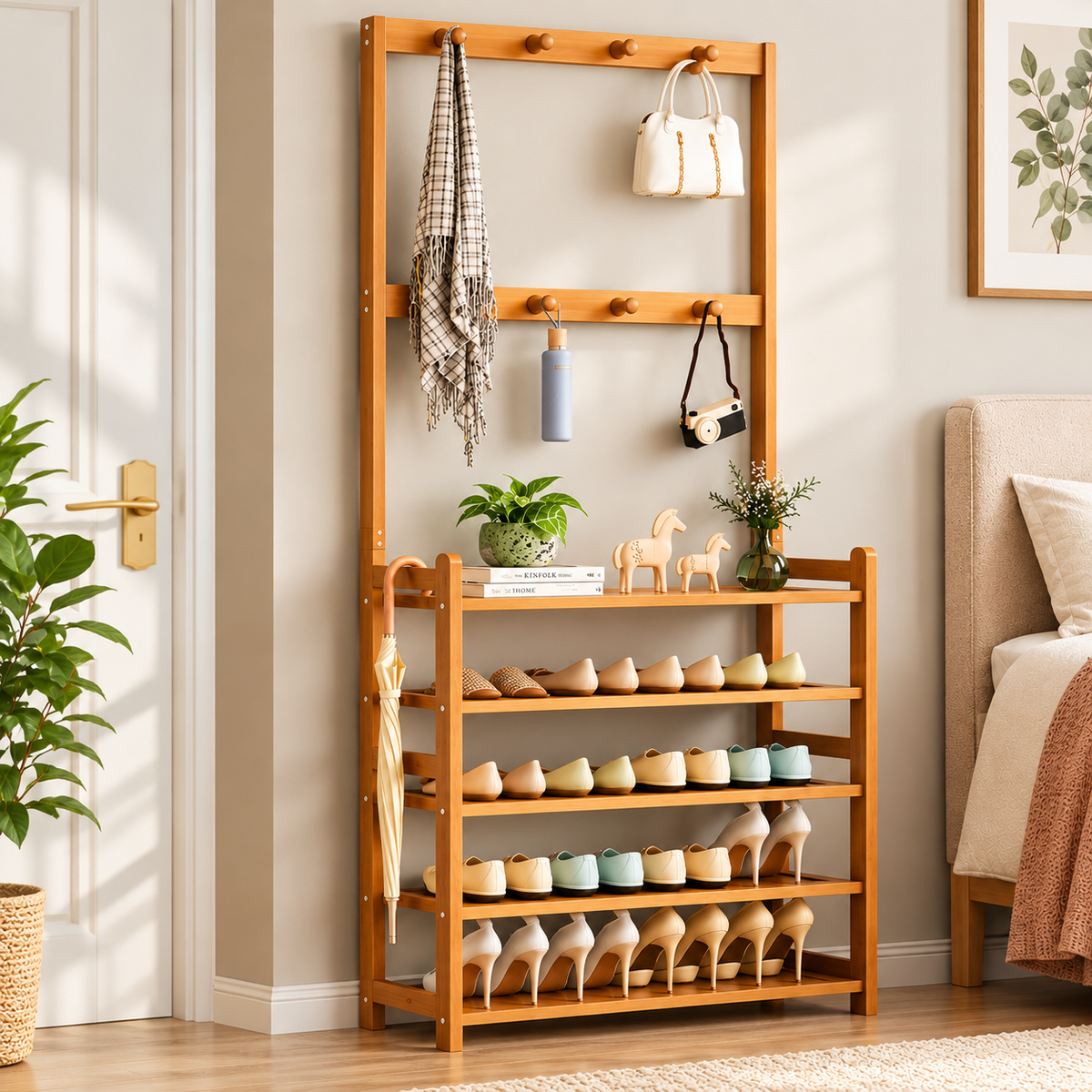 Bamboo coat and shoe rack beside a door with shoes on the shelves and a scarf, handbag, bottle and camera on the hooks