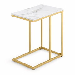 White marble look C shaped side table with a gold metal frame and open base on a white background