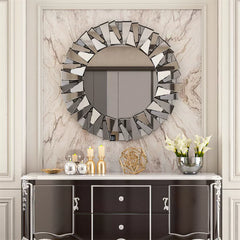 Sunburst mirror styled in an entryway