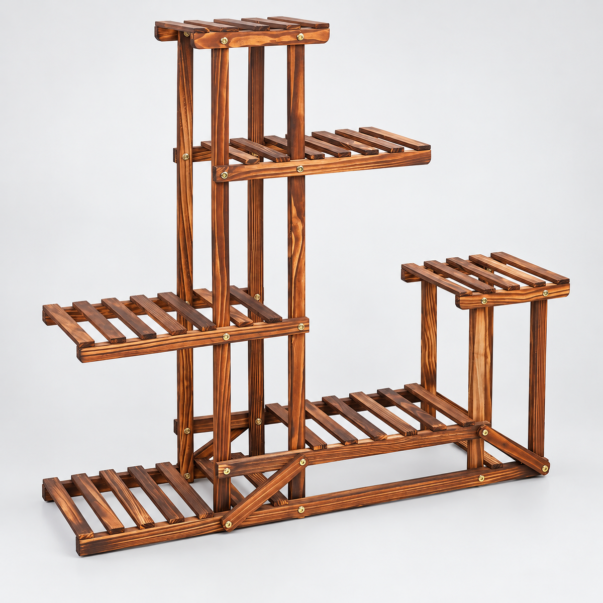 Empty brown wooden plant stand in angled side view showing the stepped slatted shelf levels